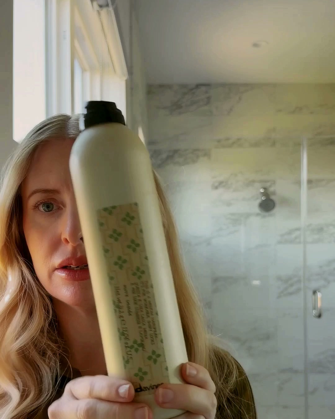 Davines hairspray held up to the camera